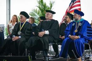 Professors on stage at the graduation ceremony